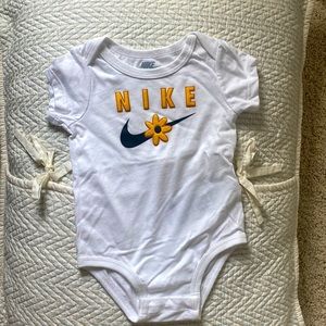 Nike daisy onesie
